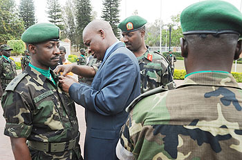 The High Representative of the African Union, Gen. Sekouba Konate on Friday decorated RDF soldiers who contributed in peace keeping in Sudanu2019s Darfur region with medals of recognition. The New Times/John Mbanda.