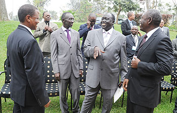 Justice Minister Tharcise Karugarama (2nd right) shares a light moment with  Deputy Chief Justice Sam Rugege(2left), Ugandau2019s Director of Public Prosecutions Richard Buteera (L) and his Deputy Amos Ngolobe at the Africa Prosecutorsu2019 Association conference