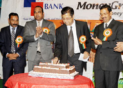 The Chairman of the Indian Community Association of Rwanda, Dinesh Kalyan (2nd Right), cuts a cake as he leads the Indian community to mark India's 65th Independence Day in Kigali yesterday. The New Times/John Mbanda