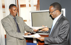  Kigali City Mayor Fidel Ndayisaba (R) and CNLG's Jean de Dieu Mucyo at the  hands over ceremony at Kigali Genocide Memorial centre, Tuesday. The New Times /John Mbanda.