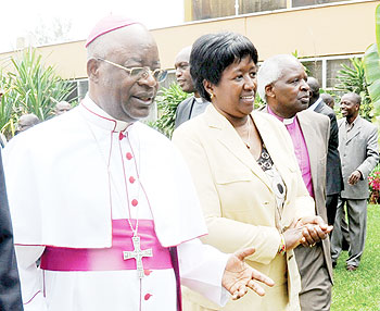 Health Minister Dr. Agnes Binagwaho (C) with religious heads, Archbishops Thadeo Ntihinyurwa (L) and Onesphore Rwaje during the fifth annual general assembly of Rwanda Interfaith Network against HIV/AIDS on Tuesday. 