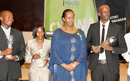 First Lady, Jeannette Kagame, with some of the recepients of this year's CYRWA Awards. The New Times/Village Urugwiro