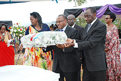  Minister in charge of Cabinet affairs Protais Musoni (C) and MP Kayinamura  (R) lay a wreath on the casket of Mzee Haajje Gashegu. The New Times/ Stella Teta.