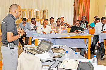  Dr.Joseph Nkurunziza talks to youths during the workshop. The New Times /Timothy Kisambira