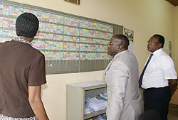 The Minister of Education,Pierre Damien Habumuremyi (C) during his tour at Kigali Lycee de Kigali with the school`s headmaster Martin M. Masabo (L). The New Times /Grace Mugoya