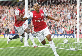 Theo Walcott celebrating after scoring aganist Udinese.  The New Times / file.