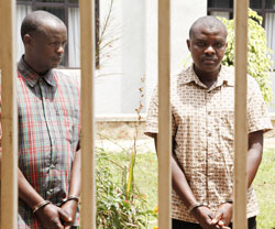 The attempted murder suspects Bernard Africa (L) and Theoneste Uwamahoro(R) are paraded at Kigali's Remera Police station yesterday. The New Times /Timothy Kisambira