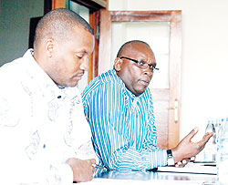 Rwanda Olympic Committee chairman Dr. Charles Rudakubana (R) addressing journalists in yesterdayu2019s press conference. Secretary General Parfait Busabizwa looks on. The New Times/Timothy Kisambira.