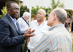 Prime Minister Bernard Makuza chats with US Congressmen after a meeting. 
