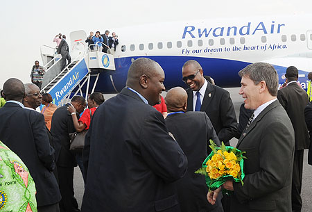 Rwandair CEO John Mirenge (in sun glasses) and Rob Faye (R), Director of Boeing Commercial Airplanes, who accompanied the new plane. The New Times / J. Mbanda