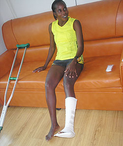 IN PAIN: Epiphanie Nyirabarame, seen here with her injured leg plastered. She did not finish the full marathon, dropping out at the halfway mark. The New Times / Courtsey.