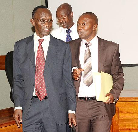  The Deputy Chief Justice, Prof. Sam Rugege (L), chats with the Deputy Prosecutor General, Alphonse Hitiyremye, after the town hall meeting, yesterday. The New Times /John Mbanda
