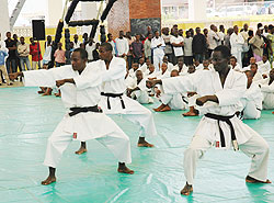 Vincent Munyeshaka [C] leads team mates  in a Kata demostration during a recent tourney in Kigali. The team targets to win medals in Maputo. The New Times / File photo