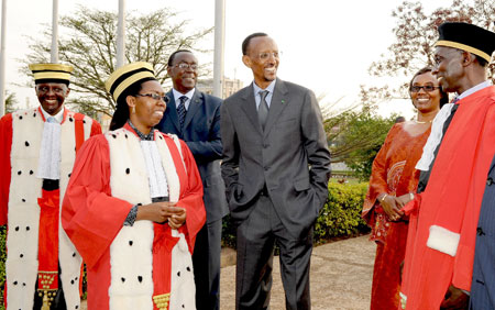 President Kagame shares a light moment with members of the judiciary; Sam Rugege u2013 Vice President of the Supreme Court (R), Aloysea Cyanzayire u2013 Supreme Court presidents and Prosecutor General, Martin Ngoga (L). Looking on is Prime Minster Makuza, (3L) an
