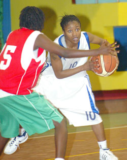 Honoru00e9 Ayebare, seen here on the right against Burundi during the zone V tourney, contributed 12 points for the ladies hoops. The New Times/File.