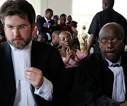  ( L-R) Lain Edwards, Ingabire Victoire (in the rear) and Gatera Gashabana in court yesterday.The New Times /Timothy Kisambira