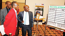 Stockbrokers trade shares during the listing of Bank of Kigali at the Kigali bourse. The New Times / T. Kisambira.