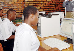 Students in a computer lab; Government's plan to distribute computers in all schools is set to enhance student's competitiveness. The New Times /File.