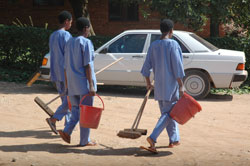 Janitors doing their chores. Over 30 percent of companies to not remit pension money to RSSB. The New Times /File.