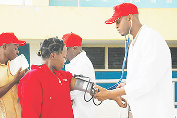 Doctor checking a womanu2019s pulse. Health workers are the precious and also, the hardly recognised heroes and heroines in our communities.