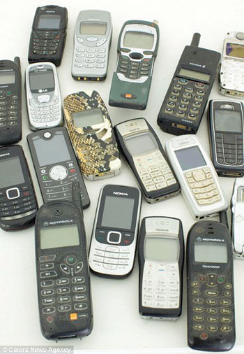 Text addict-- Ms Moberly's collection of phones she has used to store messages over the years. Net photo