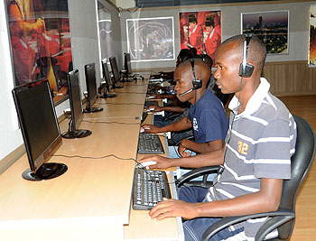 Students carry out research via internet at a local institution. Singaporean investors are looking at prospects of investing in ICT. The New Times /File Photo