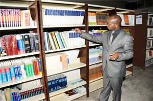 A man seaches for a book in a Library; EALA says education, research and commerce, in the bloc, are  not well linked.The New Times/ File photo