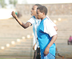 AS Kigali coach Grace Nyinawumuntu passing on tips to her players during last year's league. The club won the league. The New Times / File