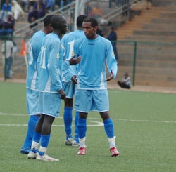 Rayon Sports players sharing ideas during a league match. The New Times / File