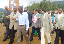 Minister Marcel Gatsinzi (2nd left) and other officials touring  Kiziba Refugee Camp. The New Times / Eric Kabera.