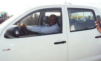 Hard work is rewarding. Apollo Rutagarama in his brand new vehicle donated by the President. The New Times/  File.