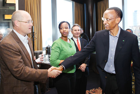  President Kagame greets Scott Ford of Rwanda Coffee Company at the PAC meeting. Clare Akamanzi, COO RDB and Dale Dawson, Bridge to Rwanda, look on. TheNew Times /Adam Scotti