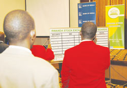 Stockbrokers at the RSE trading floor The New Times File .