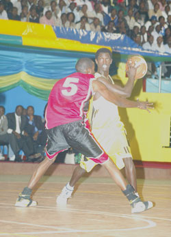 Fiston Muhire (with the ball) was overlooked for last month's Afrobasket tournament in Madagascar. The New Times / File.