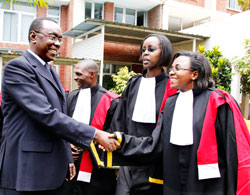 Prime Minister Bernard Makuza congratulates some of the new prosecutors after the swearing- in ceremony in Kigali yesterday .The New /Timothy Kisambira.