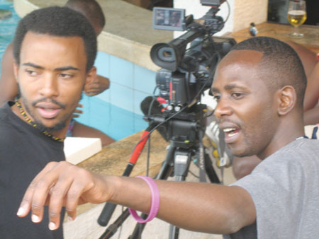 Gilbert Ndahayo (right) taking a lead behind the cameras / Net photo