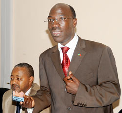  MP Theobald Mporanyi (R) displays a condom to reporters, on Thursday. The New Times / John Mbanda.