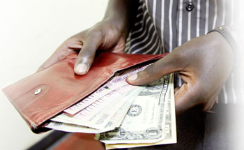 Economists argue that central bank has to raise its rates in order to control rising inflation. The New Times / T. Kisabira