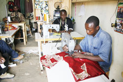 Workers in a tailoring workshop in Kigali. SMEs stand to benefit from the Guarantee Fund initiated by the Business Development Fund. The New Times / File.