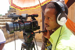 A Rwandan filmmaker demonstrates the workings of acamera during yesterday's opening of the Kwetu Film Institute in Kigali. The New Times / Courtesy.