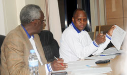 The NEC chairman, Prof. Chrysologue Karangwa,  (L) during the release of the senate elections outcome yesterday