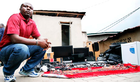 One of the suspects Jean Bosco Nzaramba who was  arrested yesterday in Kigali  with some of the stolen equipment. The New Times /Timothy Kisambira.