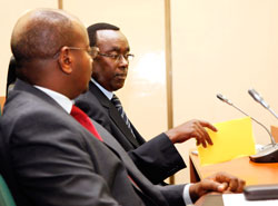 Minister James Musoni of MINALOC(L) with  Prime Minister Bernard Makuza in Senate yesterday. The New Times /Timothy Kisambira