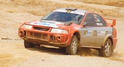 Fitidis powers his machine during the 2007 Irushanwa rally. The ace driver finished fourth in yesterdayu2019s Super Special Stage. The New Times/File.