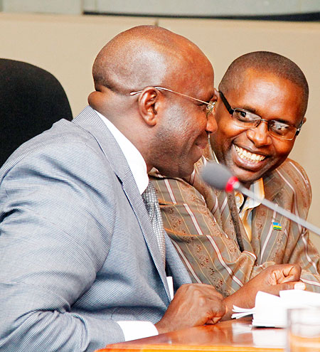 The Minister of Education, Damien Habumuremyi (L) together with State Minister Dr Mathias Harebamungu during the town hall meeting, yesterday, where the use of ICT in schools was discussed. The New Times/Timothy Kisambira.