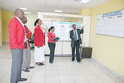 Traders at the Rwandan bourse / The New Times File photo