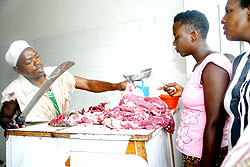 A butcher in Kimironko Market. Meat prices have been on the increase due to a scarcity of local cattle breeds