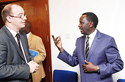 Martin Ngoga, the Prosecutor General (R) chats with Ben Llewellyn-Jones, the British High Commissioner at the beginning of the training of investigators. The New Times Timothy Kisambira