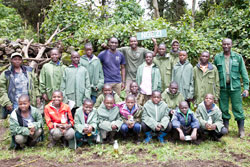 Pupils from primary schools within the Virunga area pose for a group photo with park guides during their tour of the park recently. The NewTimes / B Mukombozi