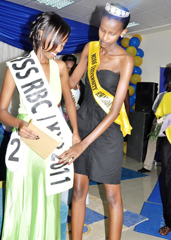 Sandra Kayitesi is crowned Miss KHI 2011 by Miss Inter-university Phiona Kamikazi.